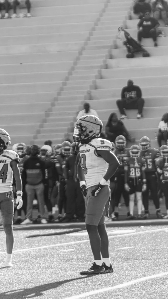 Travis Isaacs in black and white before kickoff