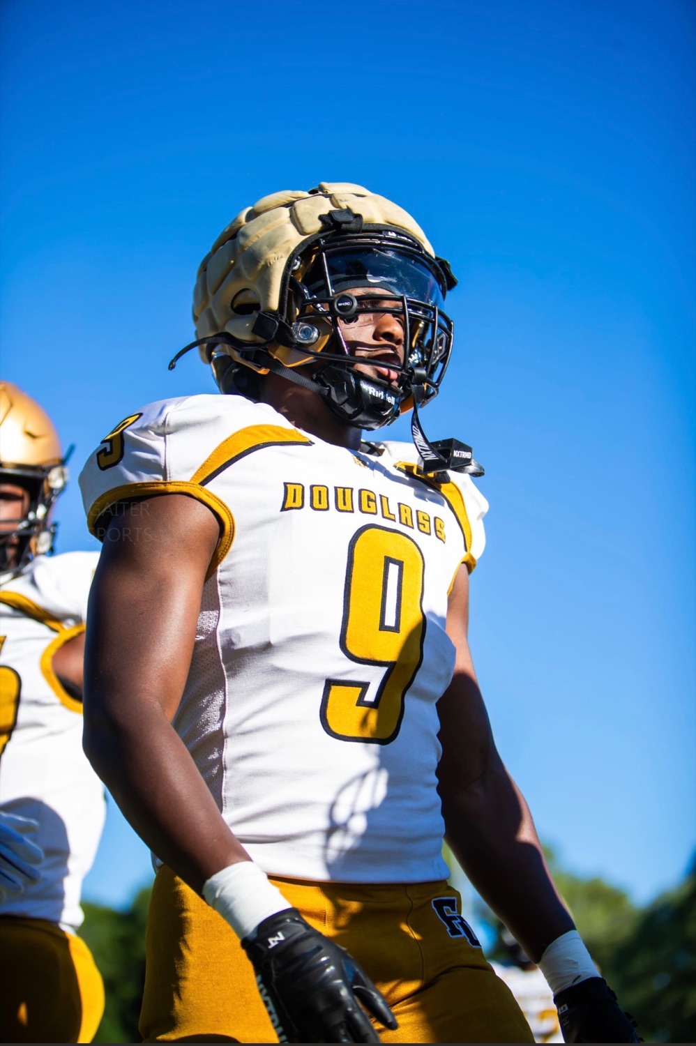 Travis Isaacs, No. 9, under a blue sky